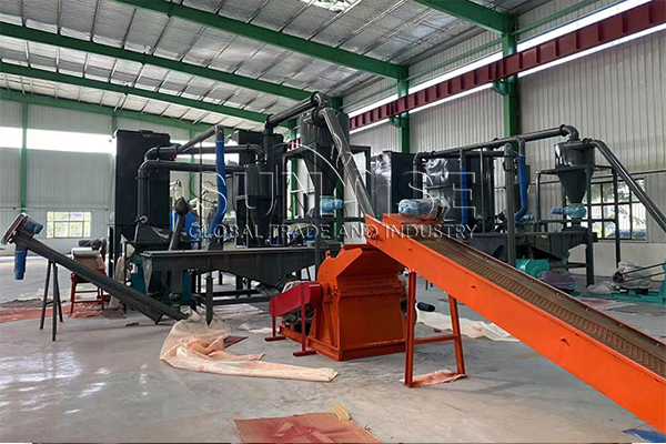 The cost of building a large recycling plant.